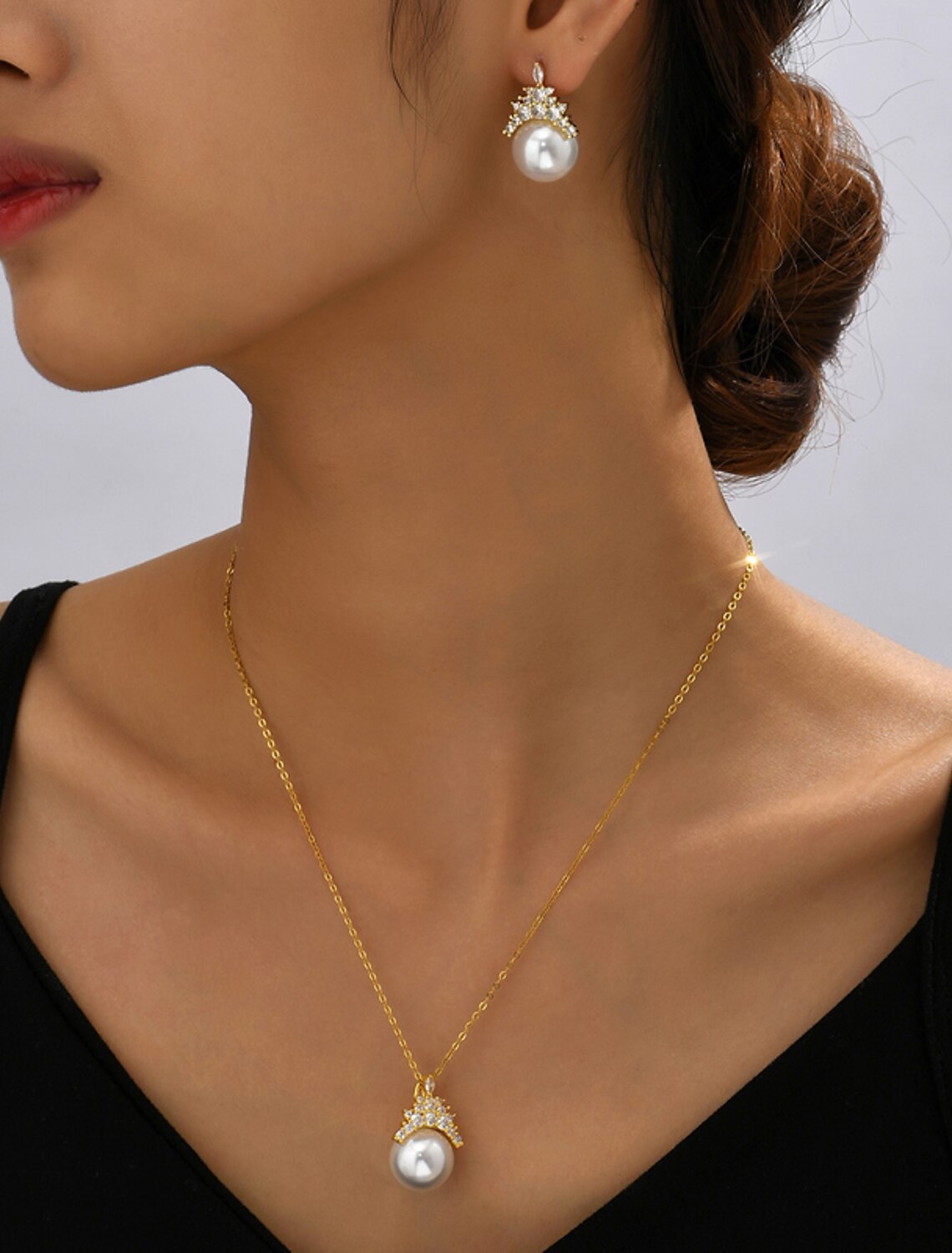 Another view of the woman showcasing the complete bridal jewelry set.
