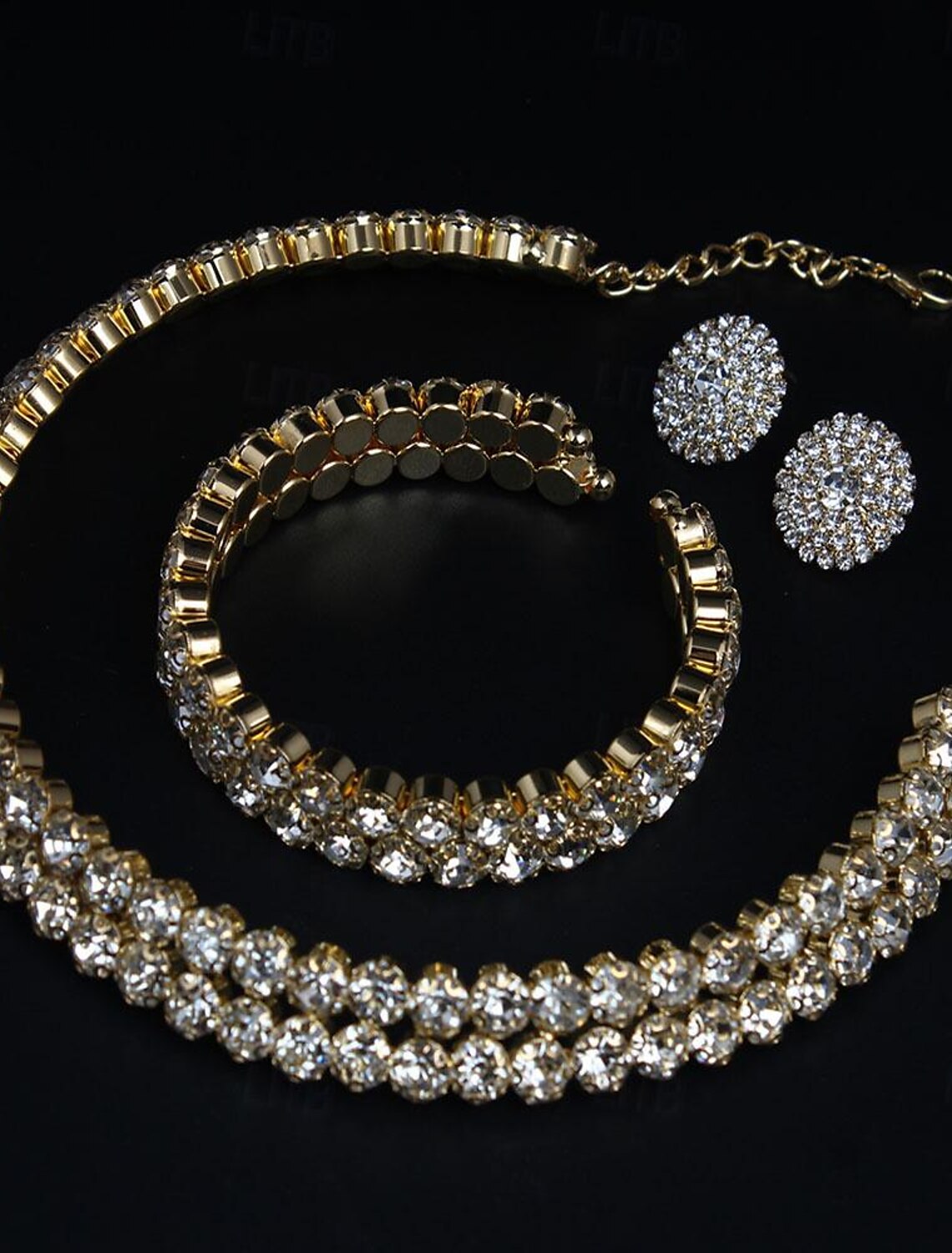 Woman wearing the complete imitation diamond bridal jewelry set.