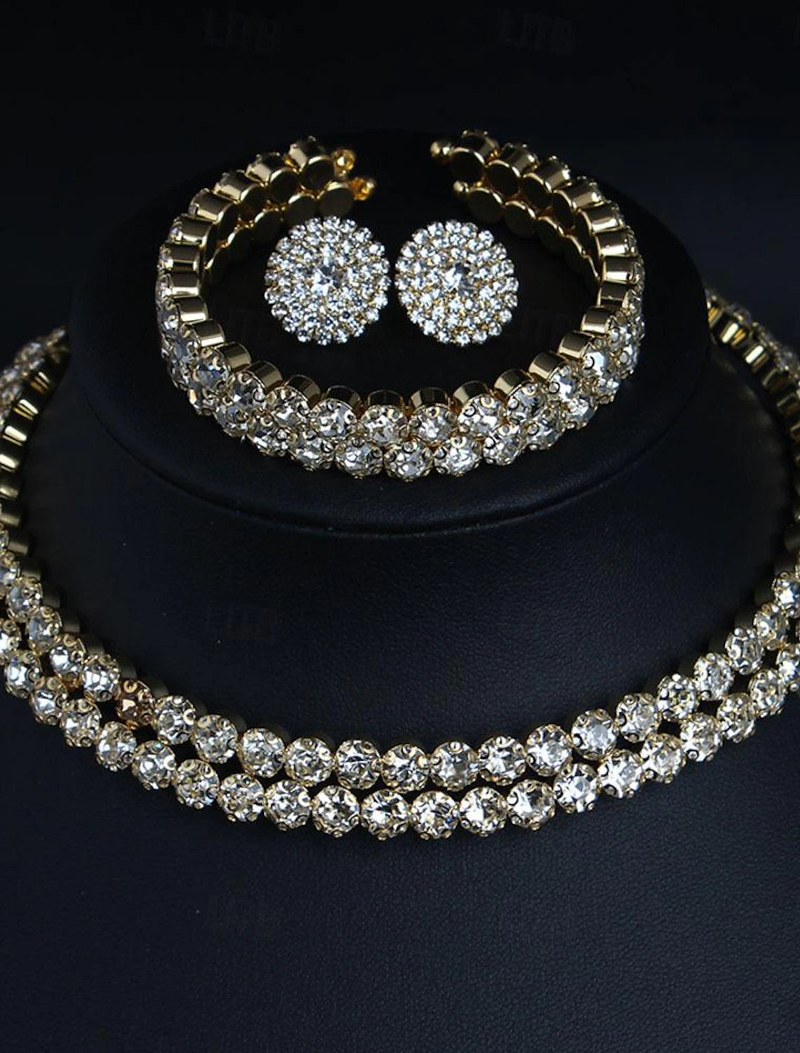 Elegant woman showcasing the imitation diamond bridal necklace and earrings.