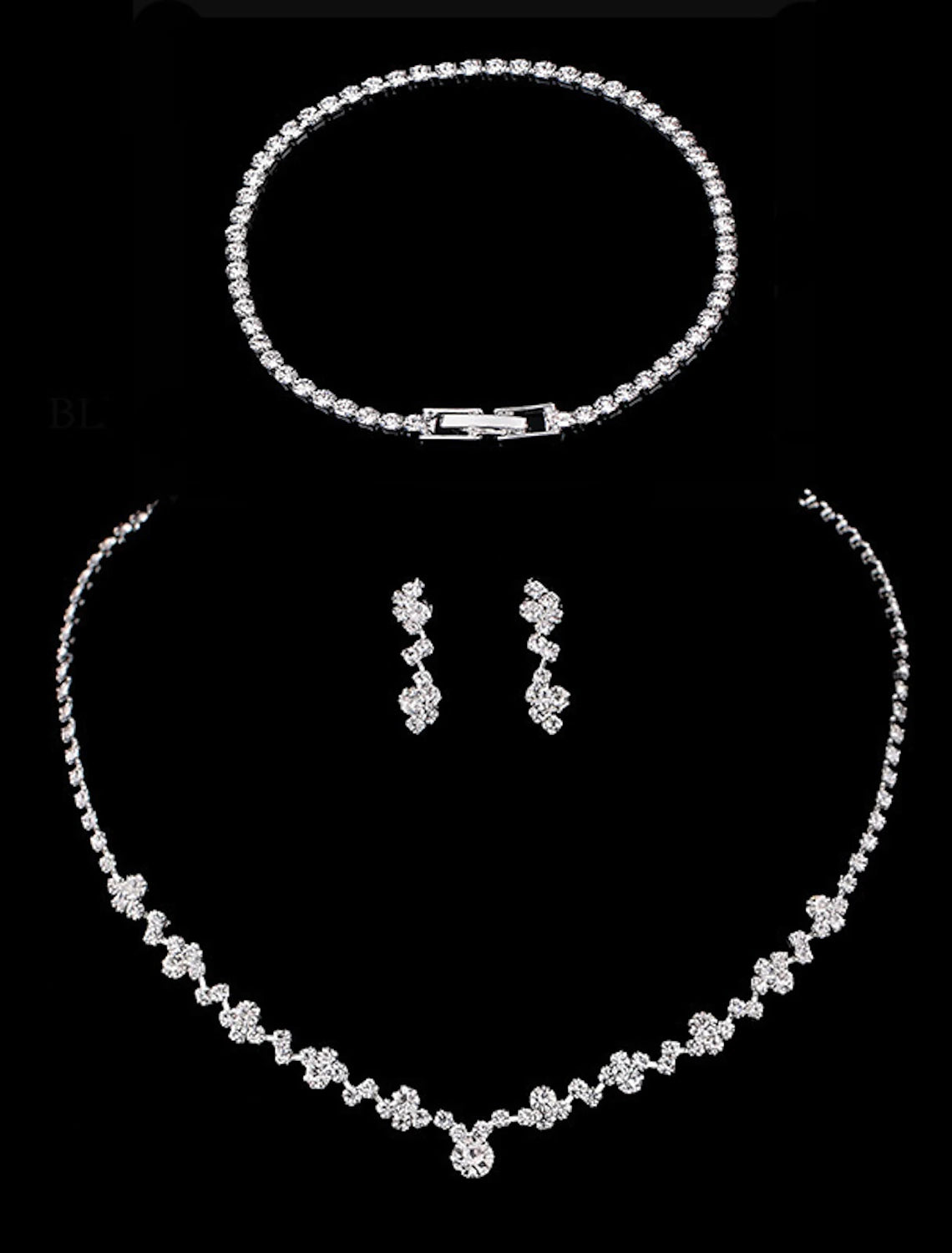 Complete bridal jewelry set featuring a synthetic diamond necklace, bracelet, and earrings.