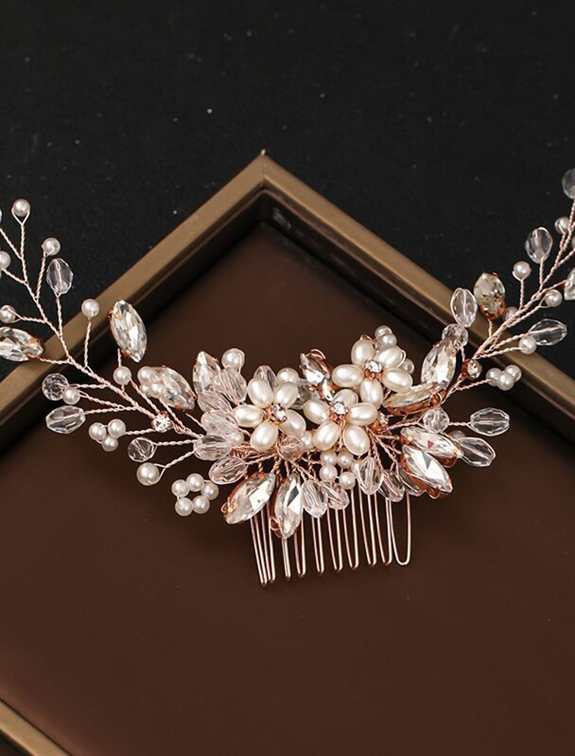 Elegant bridal hair comb adorned with faux pearls and rhinestones, viewed from the front.