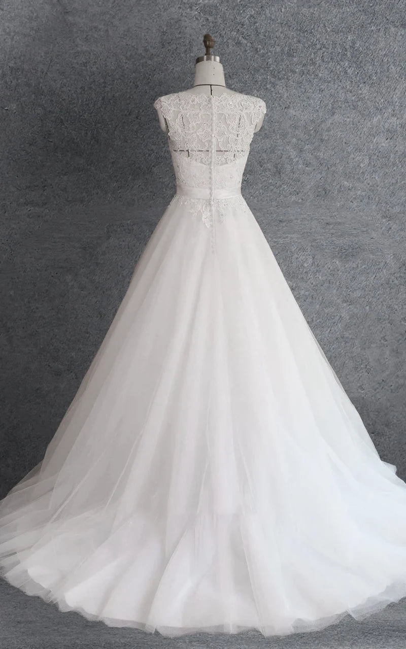 Close-up of the delicate lace and beading details on the formal ball gown.