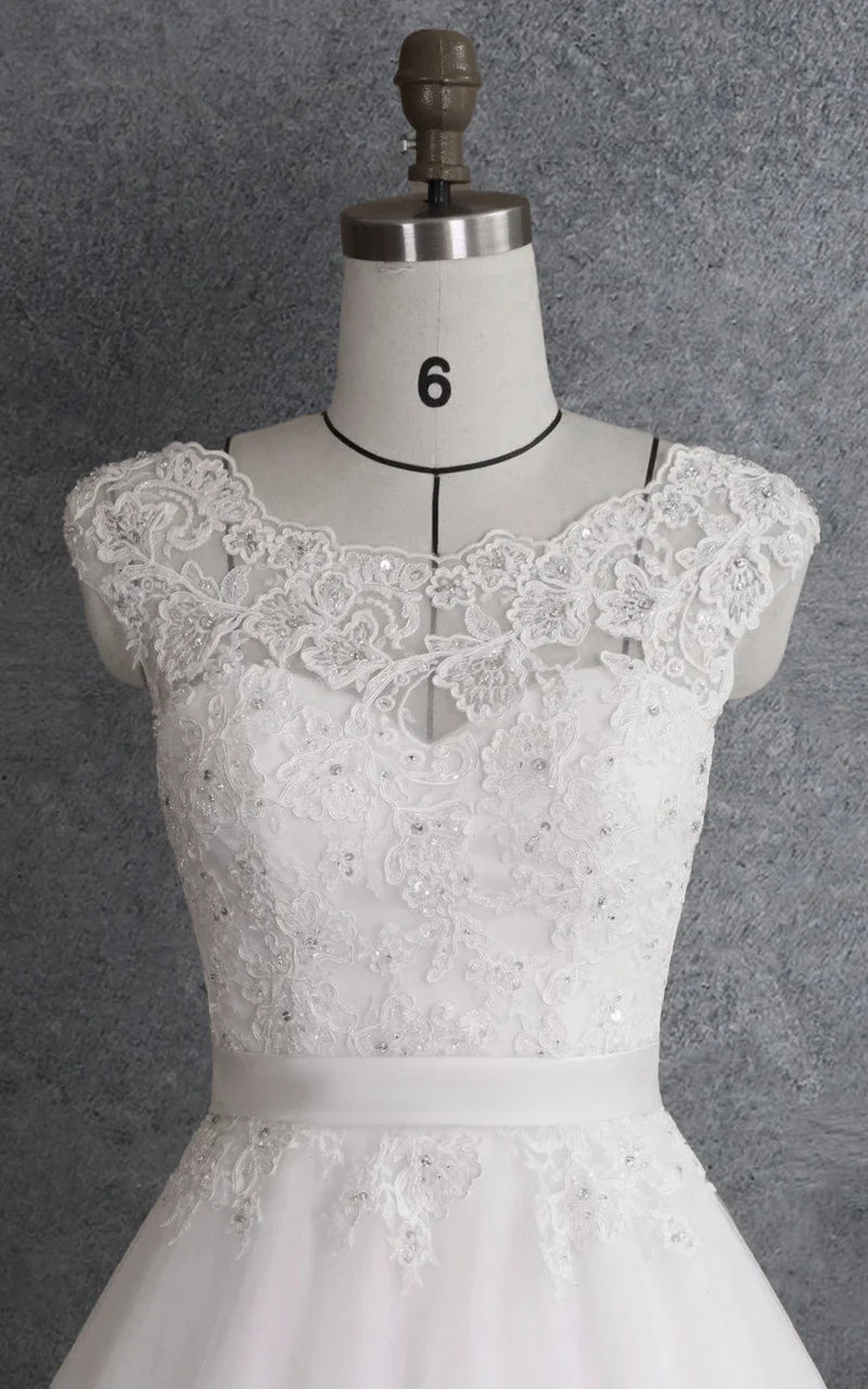 Full length view of the elegant silver ball gown, showcasing its flowing skirt.