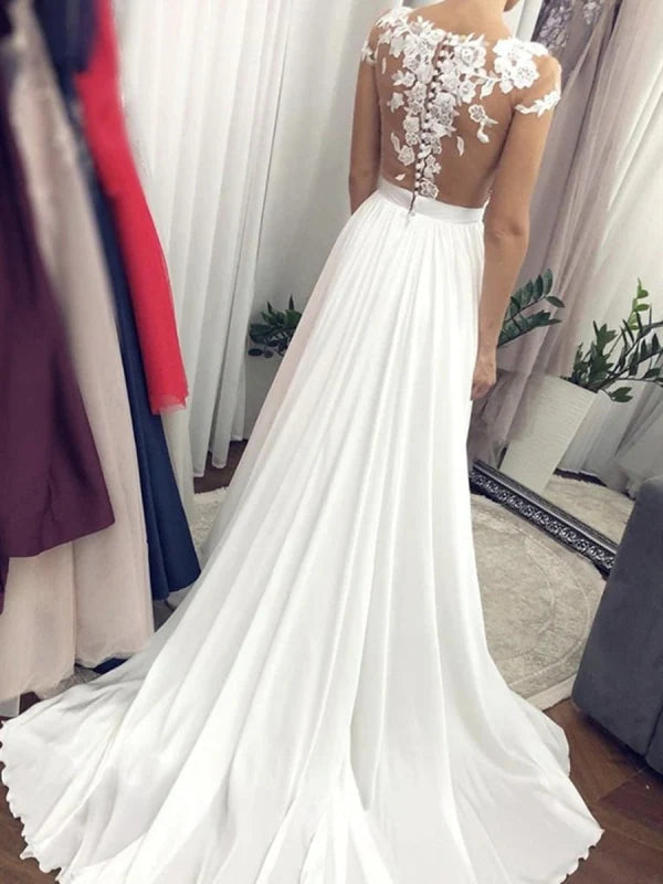 Full view of the long lace bridal dress.