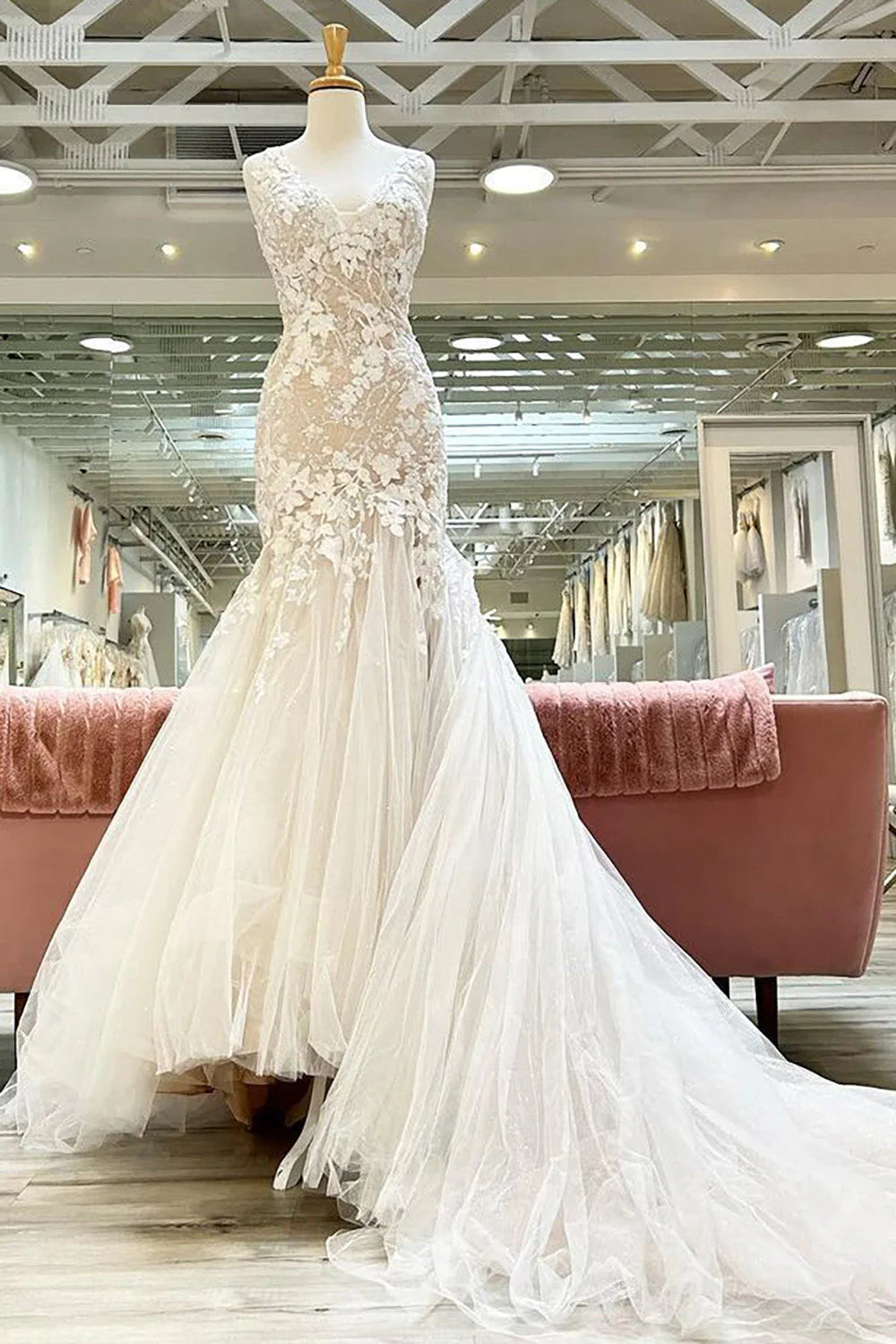 Champagne mermaid V-neck wedding dress with appliques.