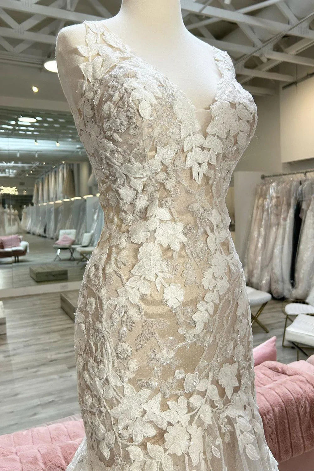 Close-up of appliques on champagne mermaid wedding dress.