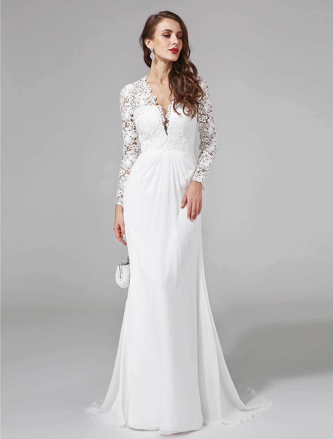 Back view of boho wedding dress showing sweep train and lace button details.