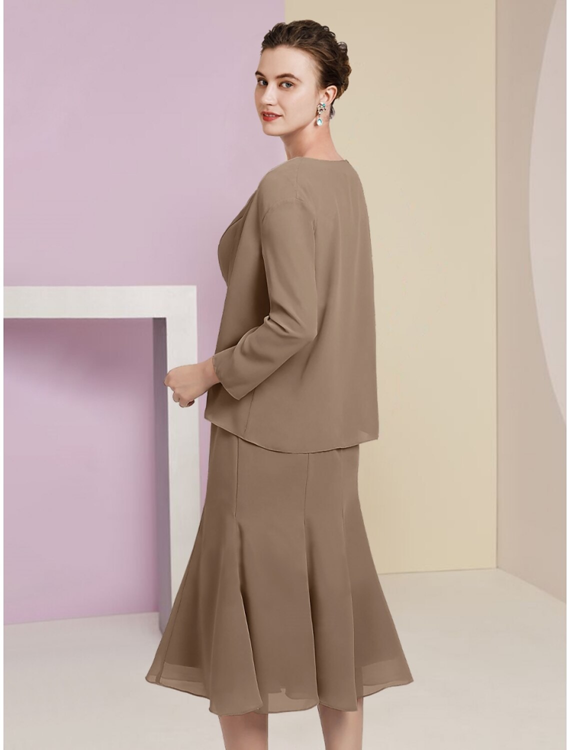 Back view of the tea length mermaid trumpet mother of the bride dress.