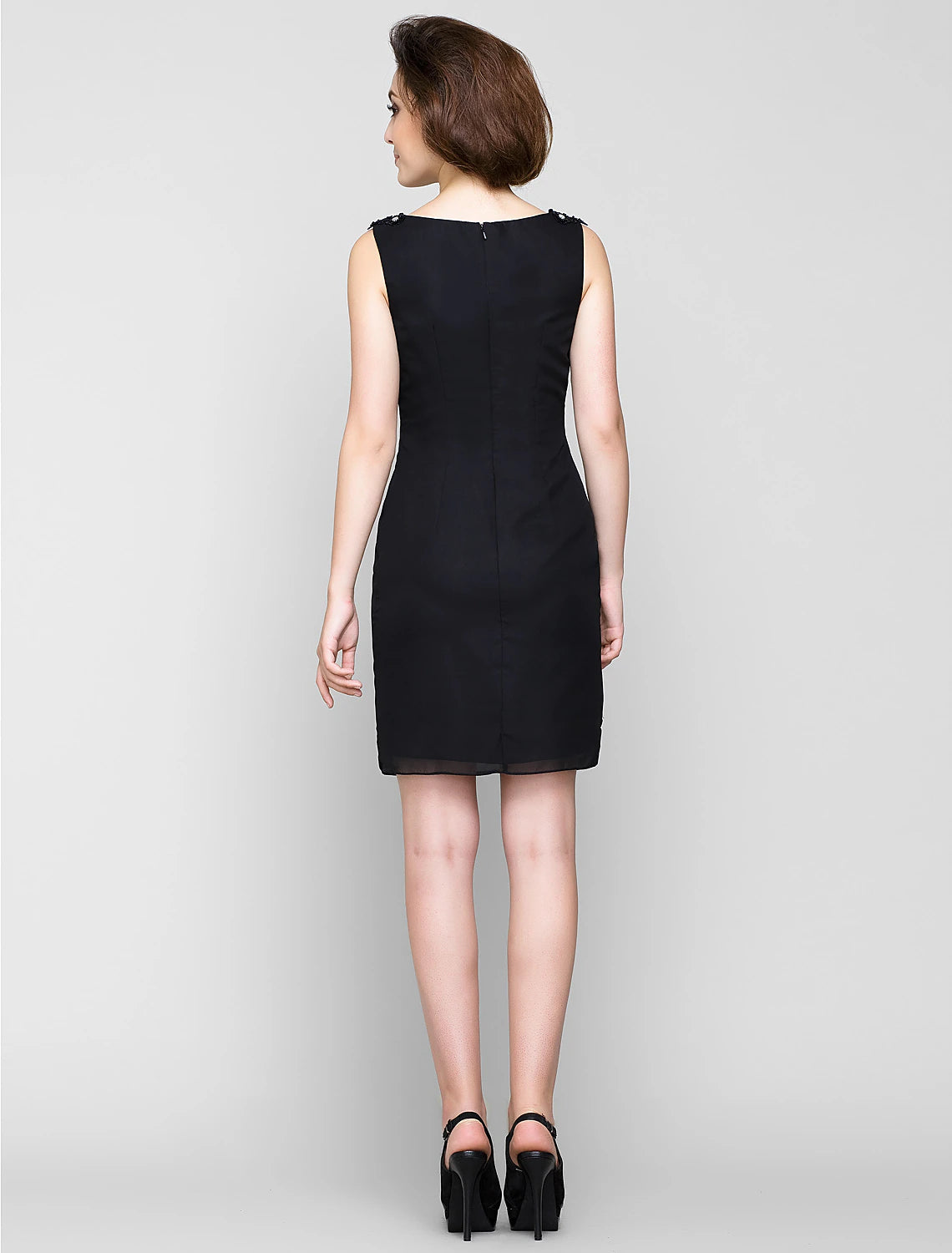 Close-up of the chiffon fabric and crystal details on the dress.