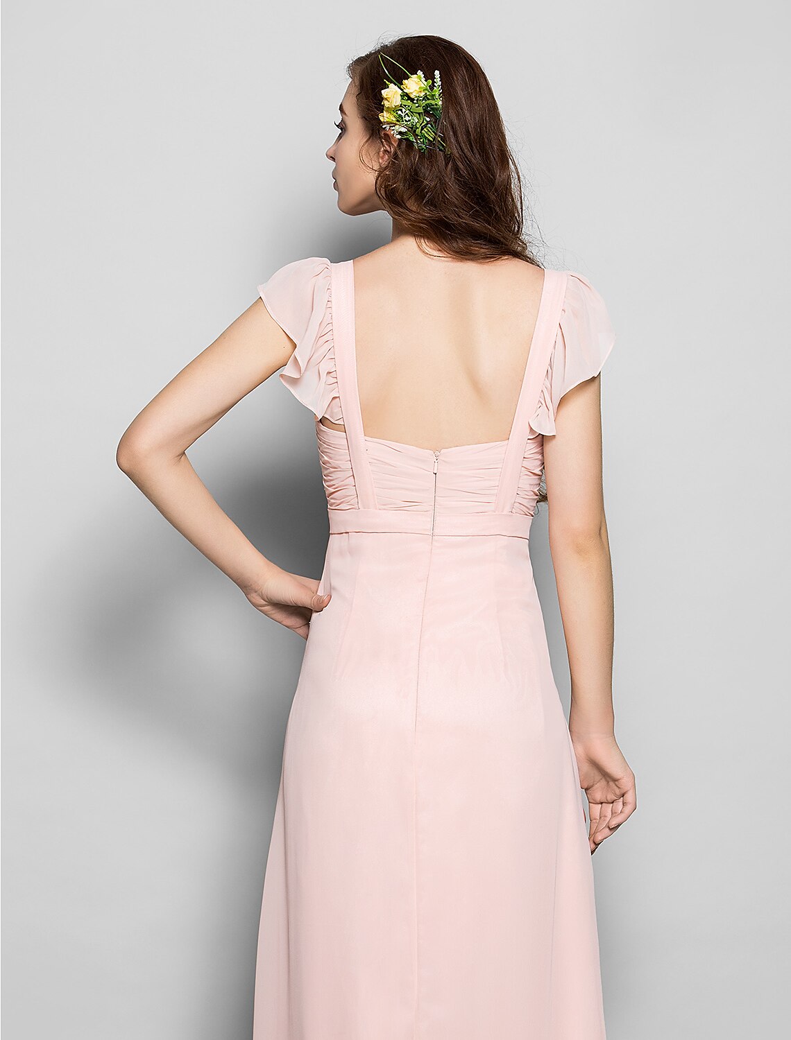 Detail of the delicate straps and neckline of the chiffon bridesmaid gown.