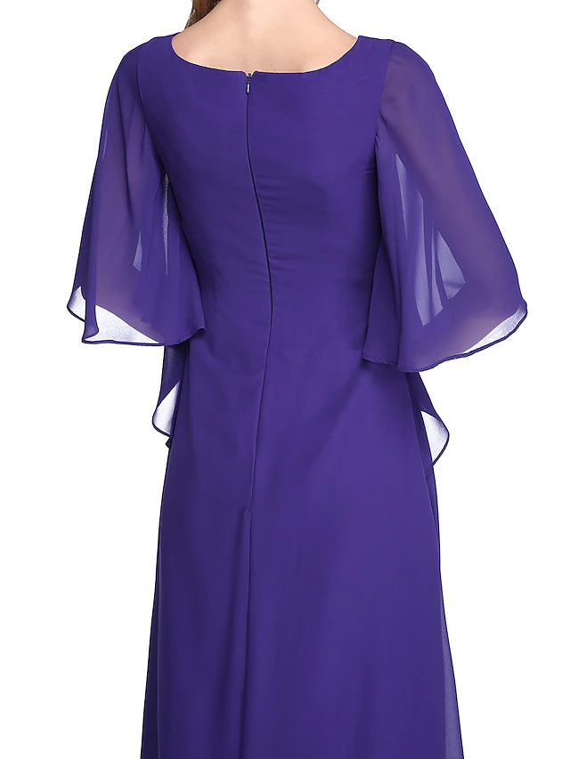 Full length view of the elegant chiffon gown, highlighting the floor length silhouette.