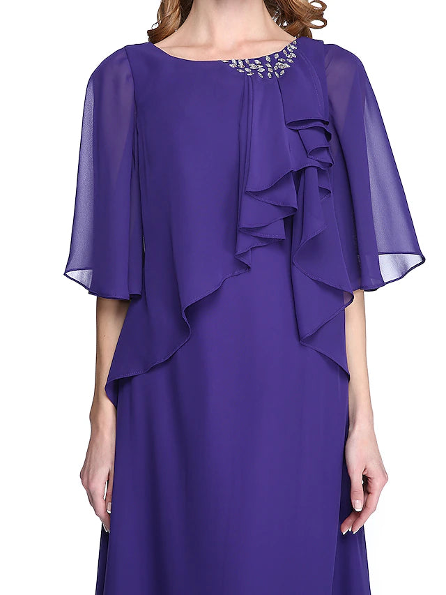 Detail of the beading and ruffle embellishments on the chiffon mother of the bride dress.