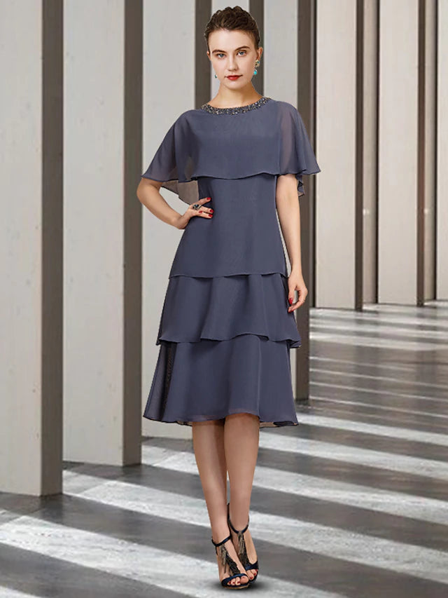 Elegant chiffon sheath Mother of the Bride dress with jewel neck and short sleeves.