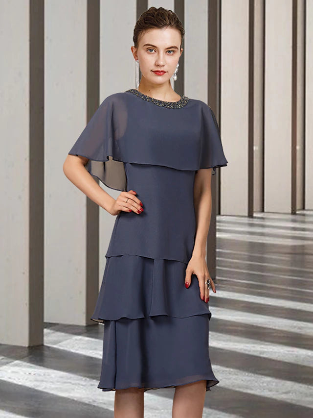 Back view of the elegant chiffon sheath dress, showing delicate ruffles.