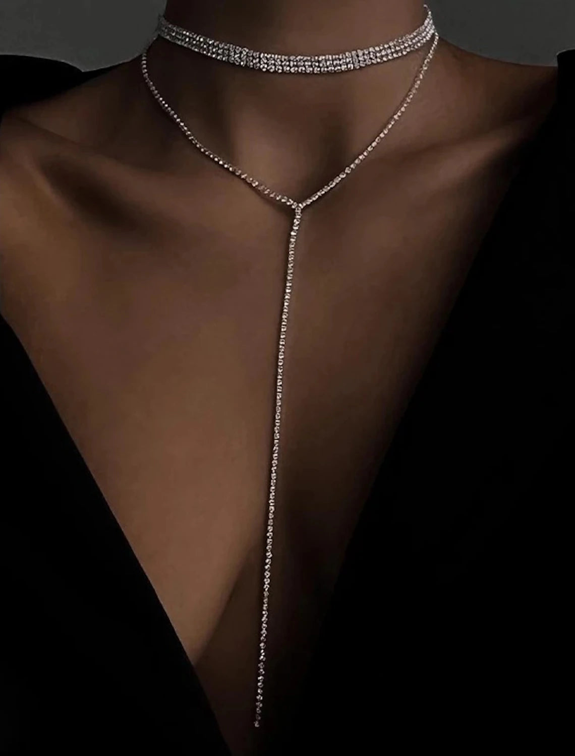 Clear rhinestone geometric necklace displayed on a white background.