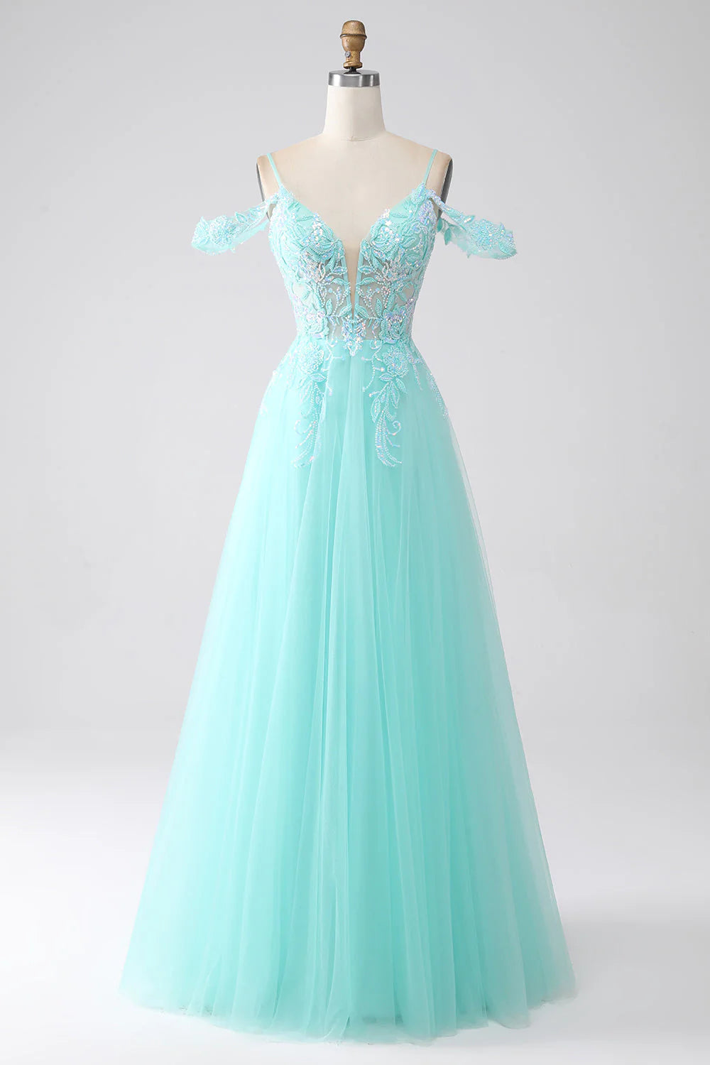 Light green cold shoulder sequin prom dress, front view.