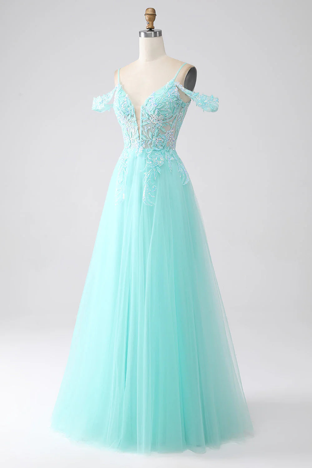 Back view of elegant light green cold shoulder sequin gown.