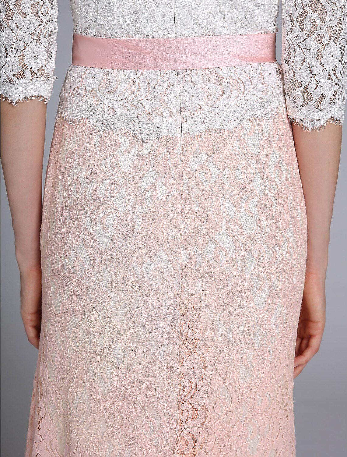 Detail of the half sleeves and jewel neckline on the formal gown.