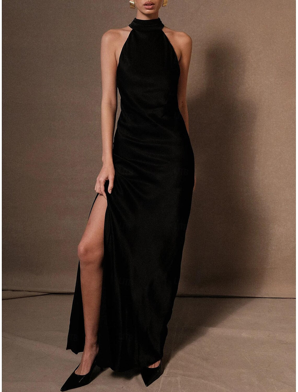 Elegant column halter neck wedding guest dress, front view.