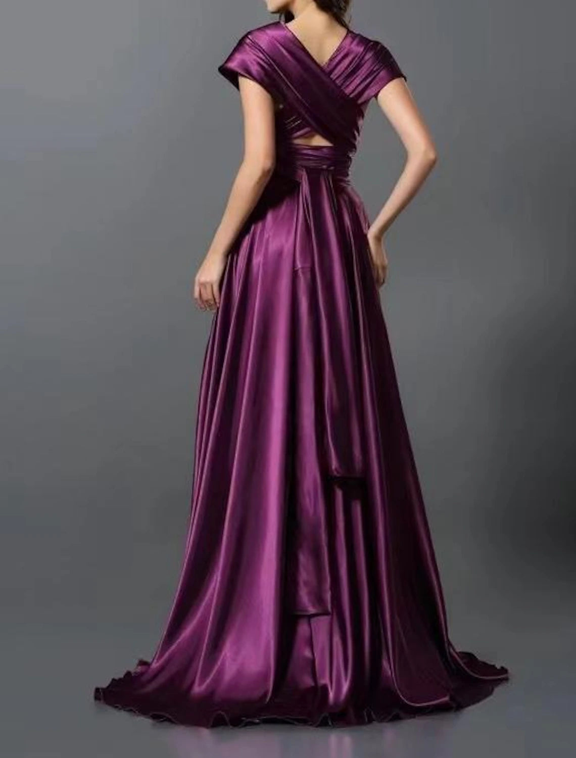 Back view of the convertible dress, emphasizing the elegant drape and court train.