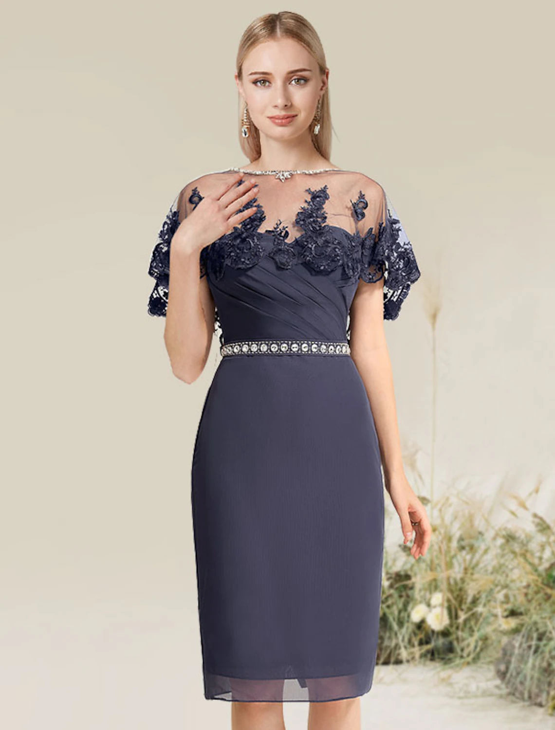 Woman wearing a strapless convertible infinity sheath cocktail dress with lace appliques.