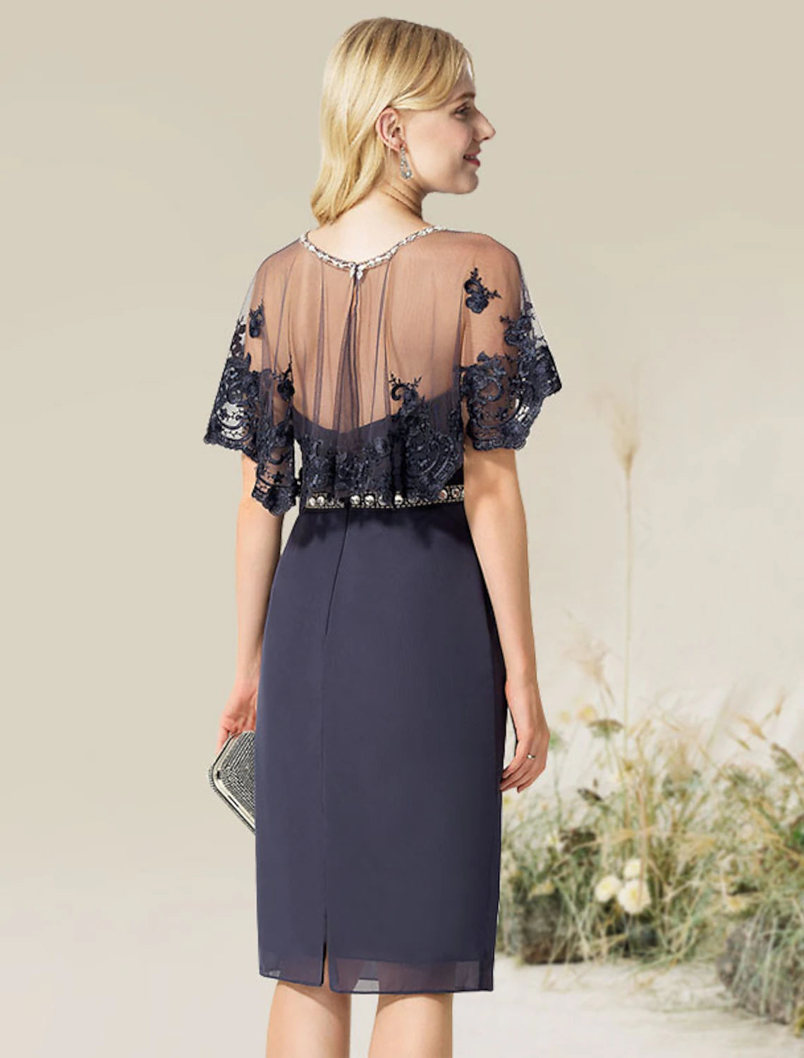 Woman wearing the convertible infinity dress styled with a V-neckline.