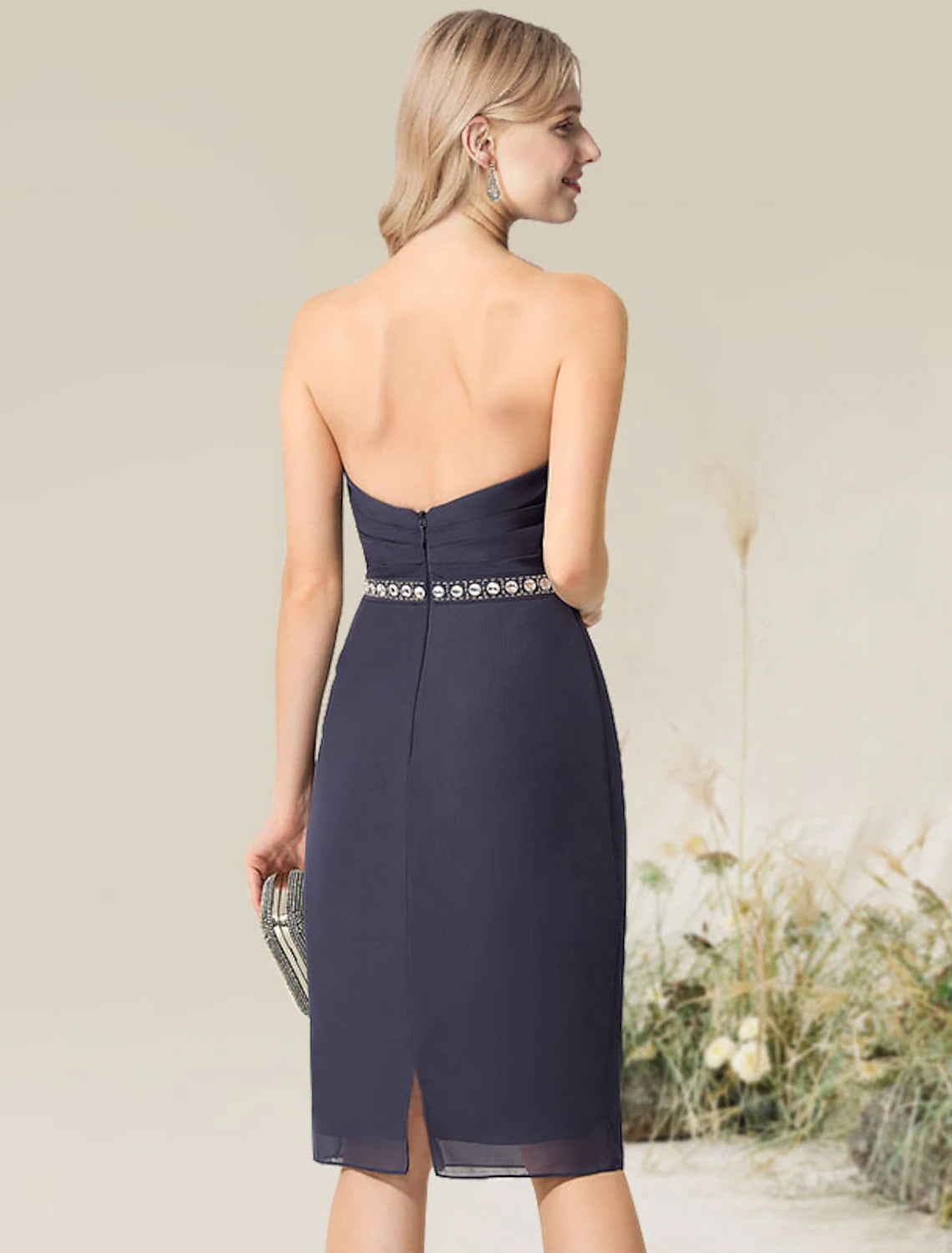 Back view of the convertible infinity sheath dress showing lace applique details.