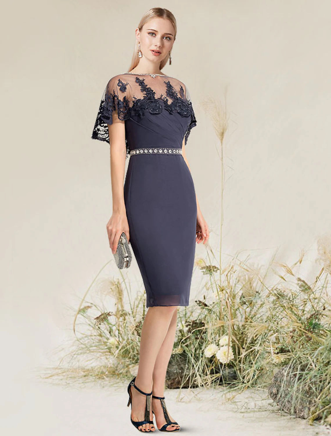 Close-up of the delicate lace appliques on the convertible cocktail dress.