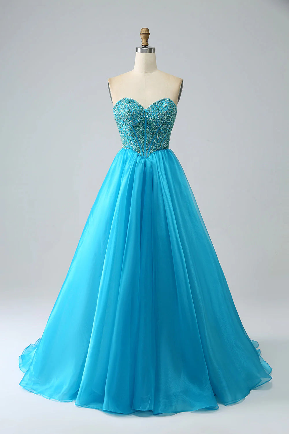 Back view of a blue corset A-line prom dress with detachable sleeves.