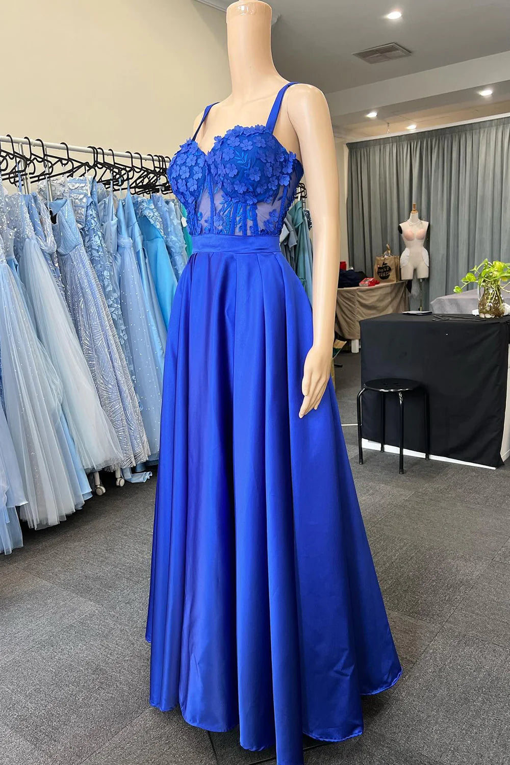Royal blue prom dress with spaghetti straps and corset bodice.