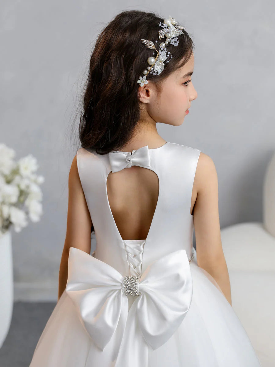 Close-up of the beaded waist and bowknot detail on the tulle dress.