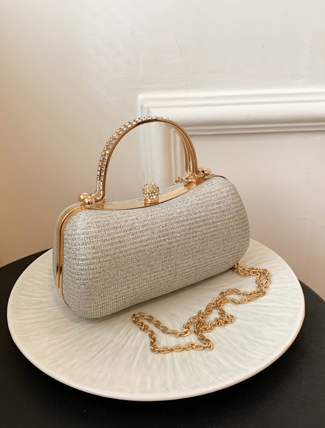 Women's formal crystal clutch, side view.