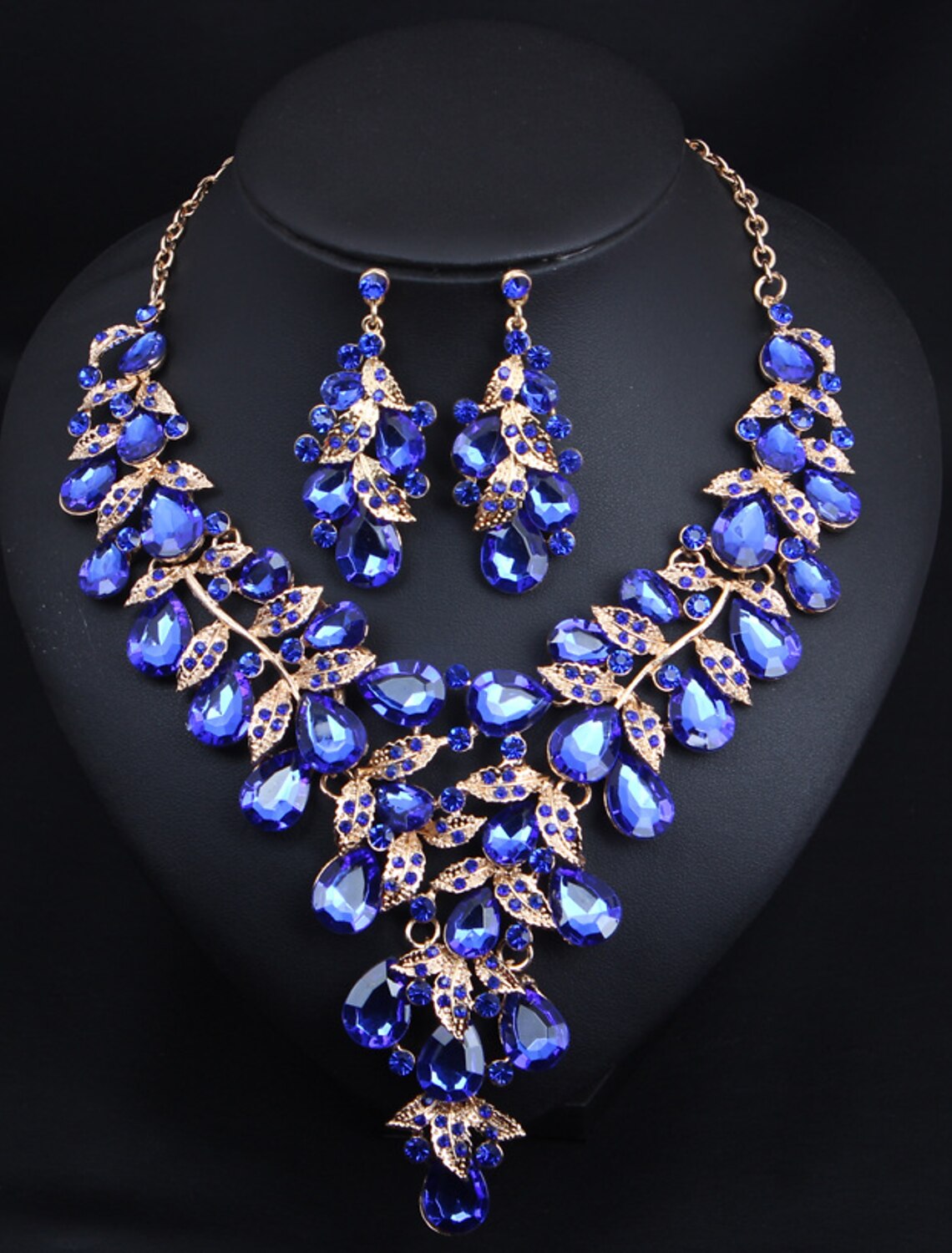 Model wearing a sparkling crystal rhinestone necklace and earrings.