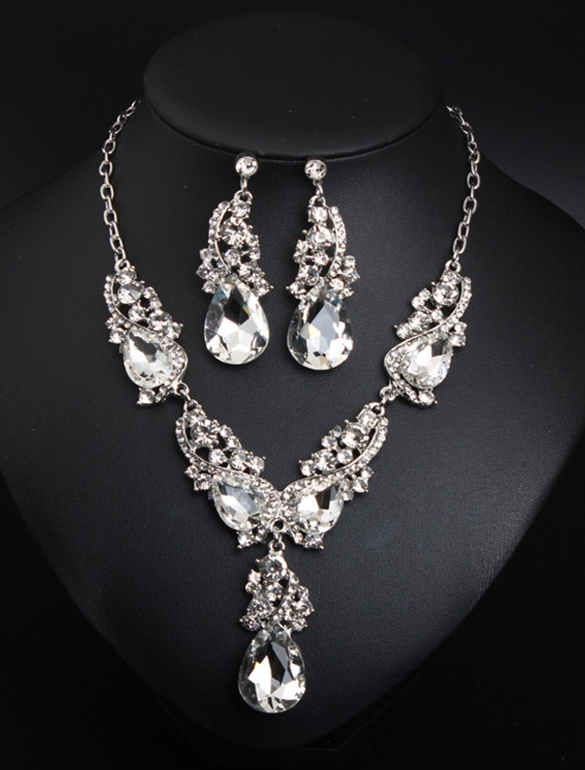 Close-up of crystal rhinestone bridal necklace with flower drop design.