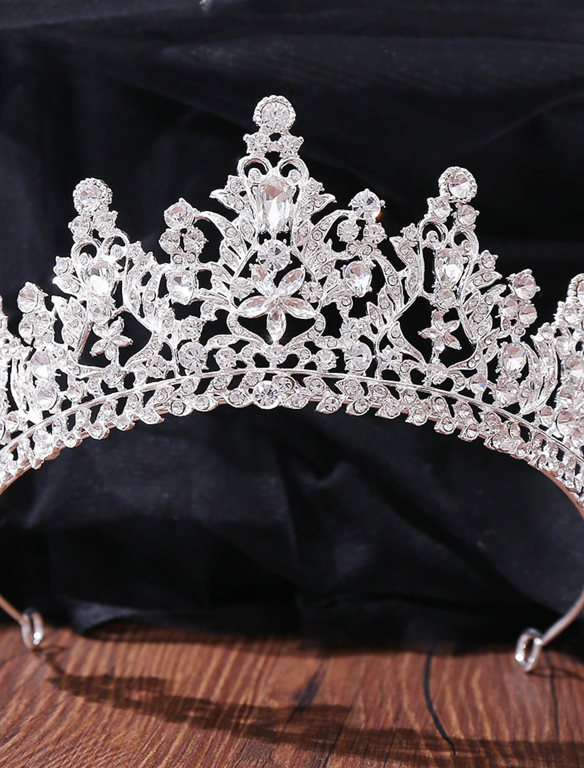 Close-up of crystal and rhinestone details on a bridal tiara.
