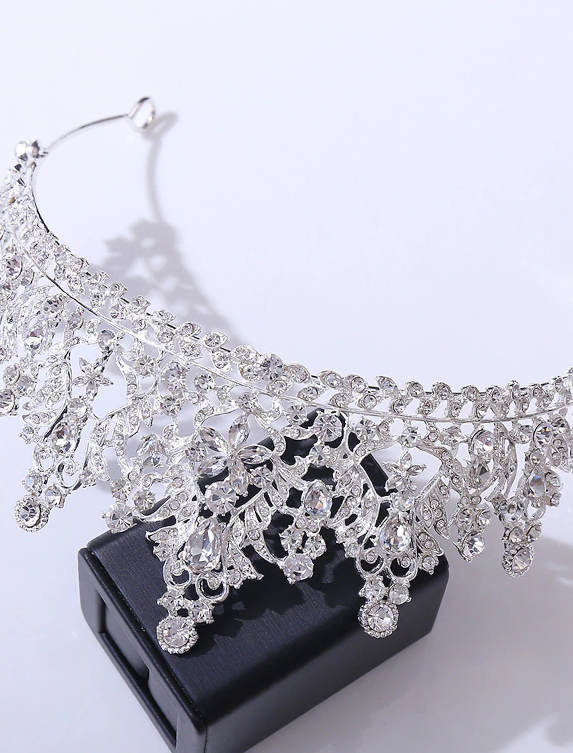 Rhinestone alloy tiara with intricate crystal patterns.