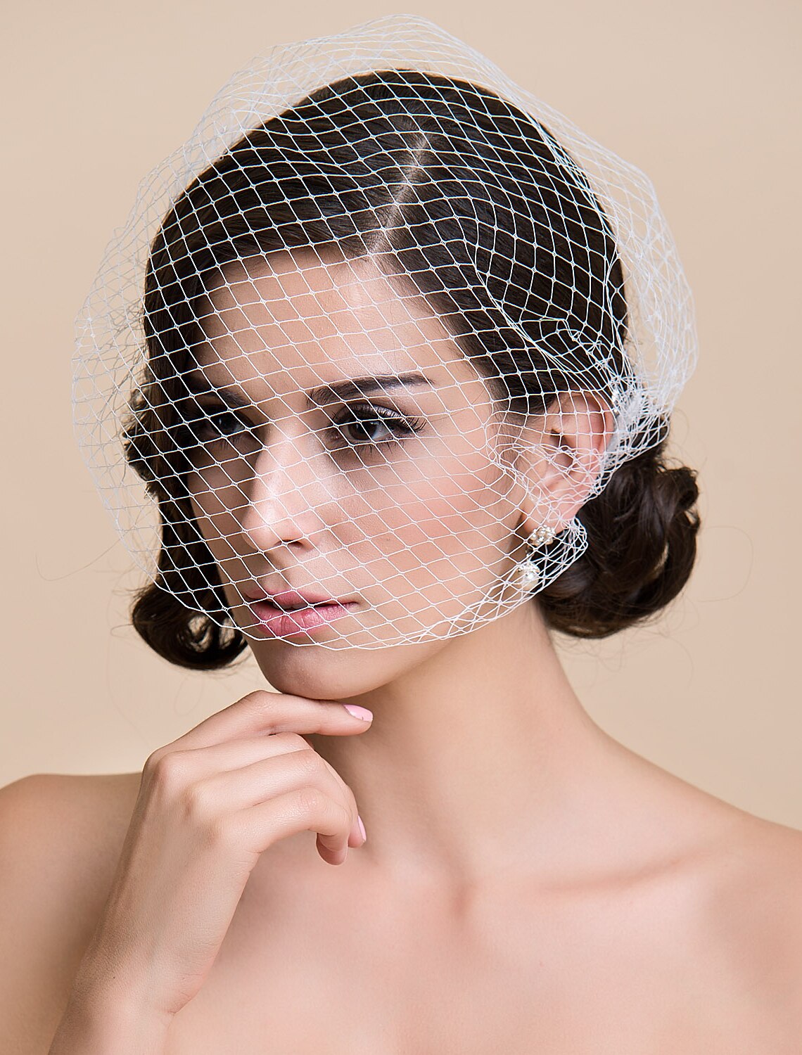 Elegant blusher veil with a clean cut edge, suitable for weddings.