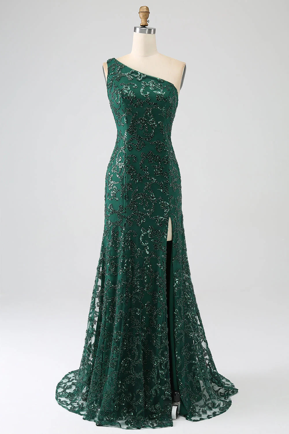 Model wearing an elegant dark green mermaid lace prom dress with a high slit.