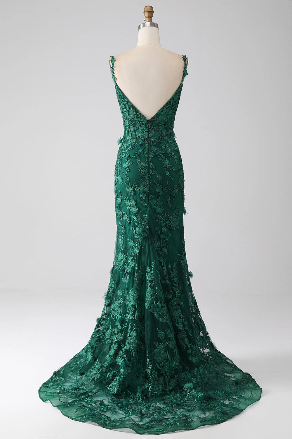 Side view of the dark green mermaid prom dress, highlighting the fitted silhouette and appliques.