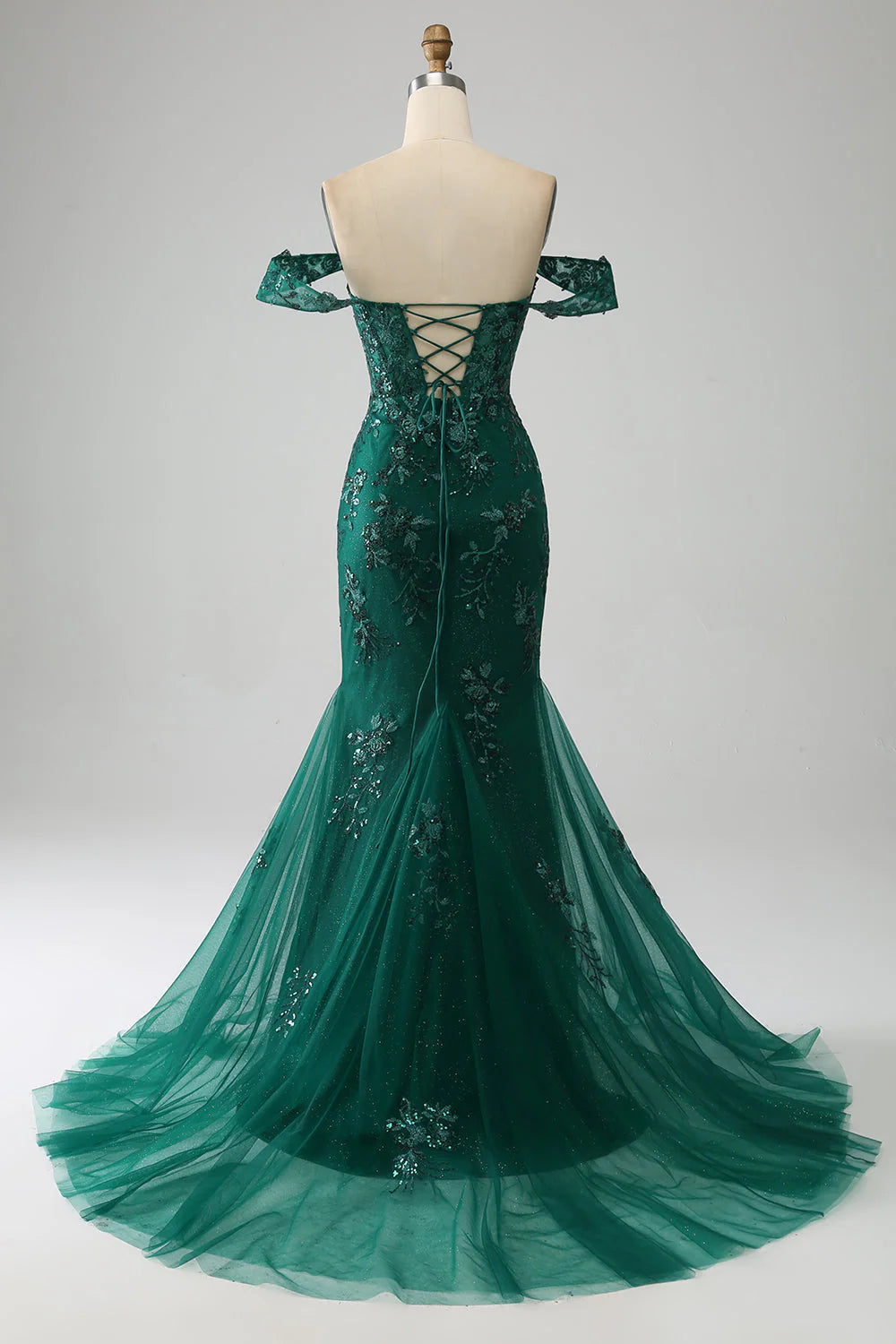 Side view of the dark green mermaid off-shoulder prom dress, highlighting the silhouette.