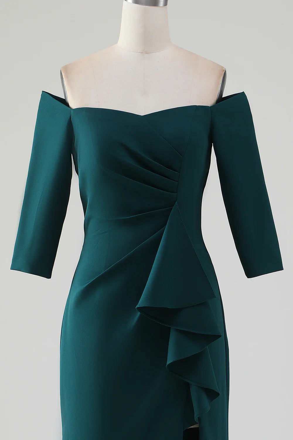 Full length view of the dark green mermaid off-shoulder dress with ruffles.