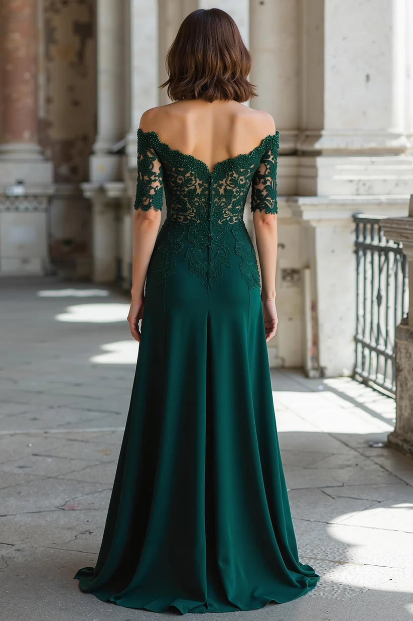 Close-up of lace and chiffon fabric on the dark green off-the-shoulder dress.
