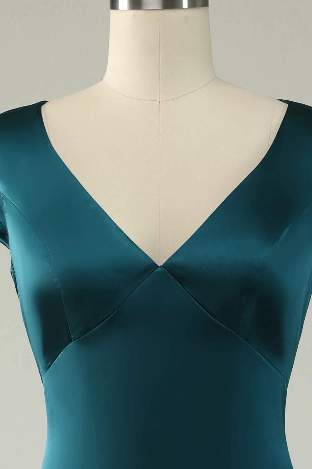 Back view of the dark green satin V-neck A-line long prom dress.