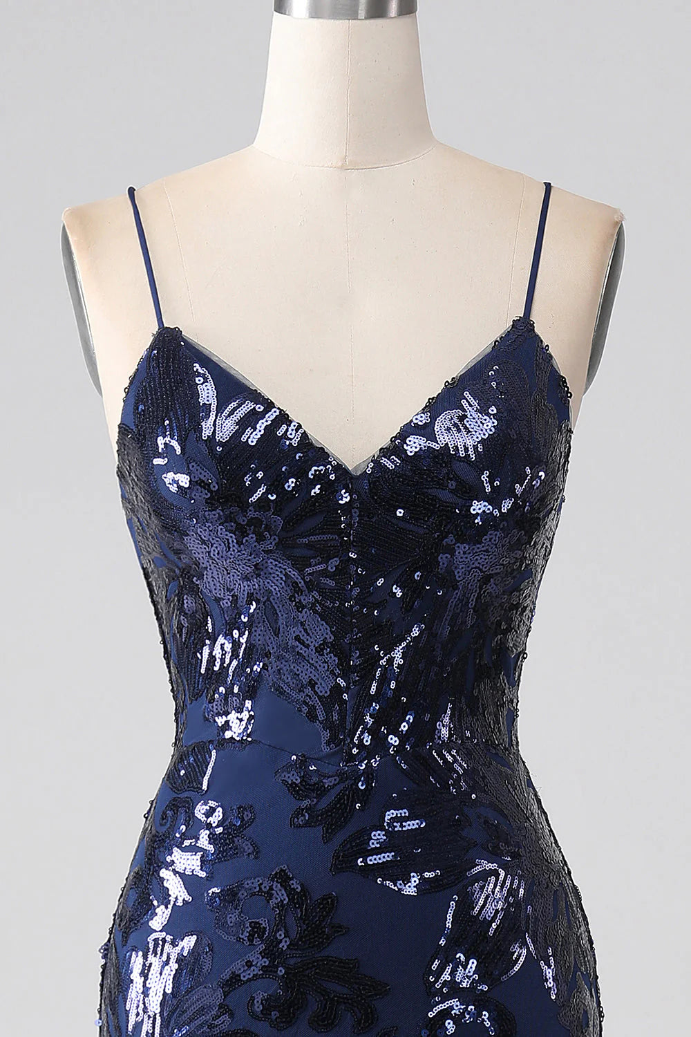 Full length view of a dark navy mermaid prom dress.