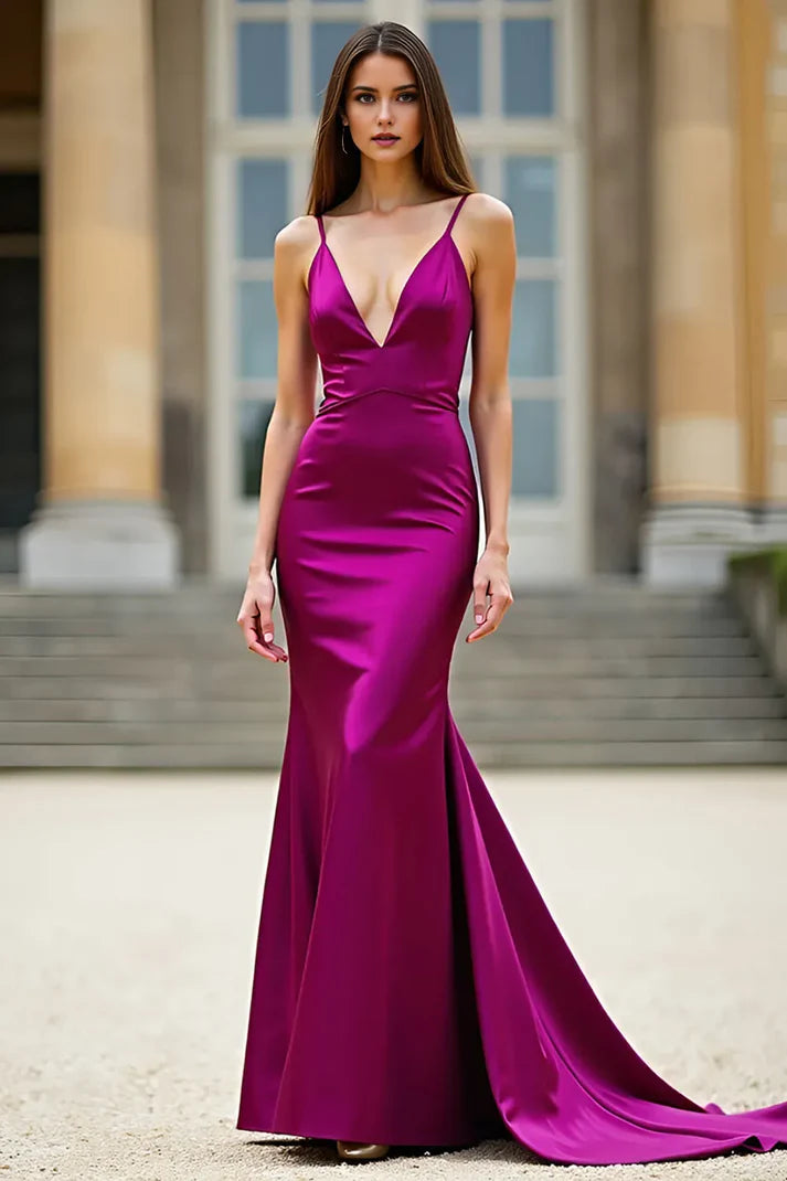 Front view of a model wearing an elegant dark purple mermaid prom dress with a deep V-neck.