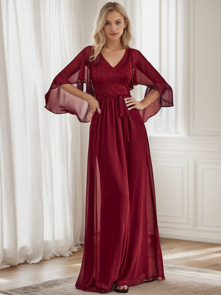 Elegant deep V-neck lace bodice long flowy evening dress in burgundy.