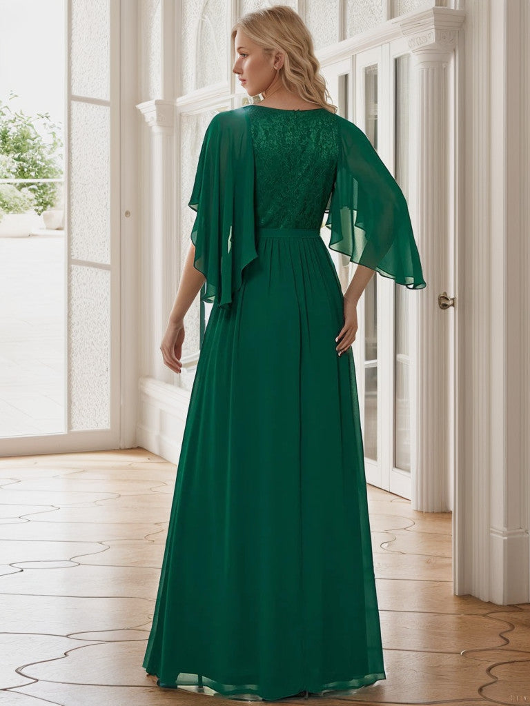 Back view of the dark green deep V-neck lace bodice long flowy evening dress.