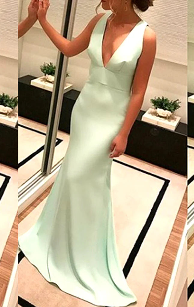 Elegant deep V-neck long prom gown with a flowing skirt.