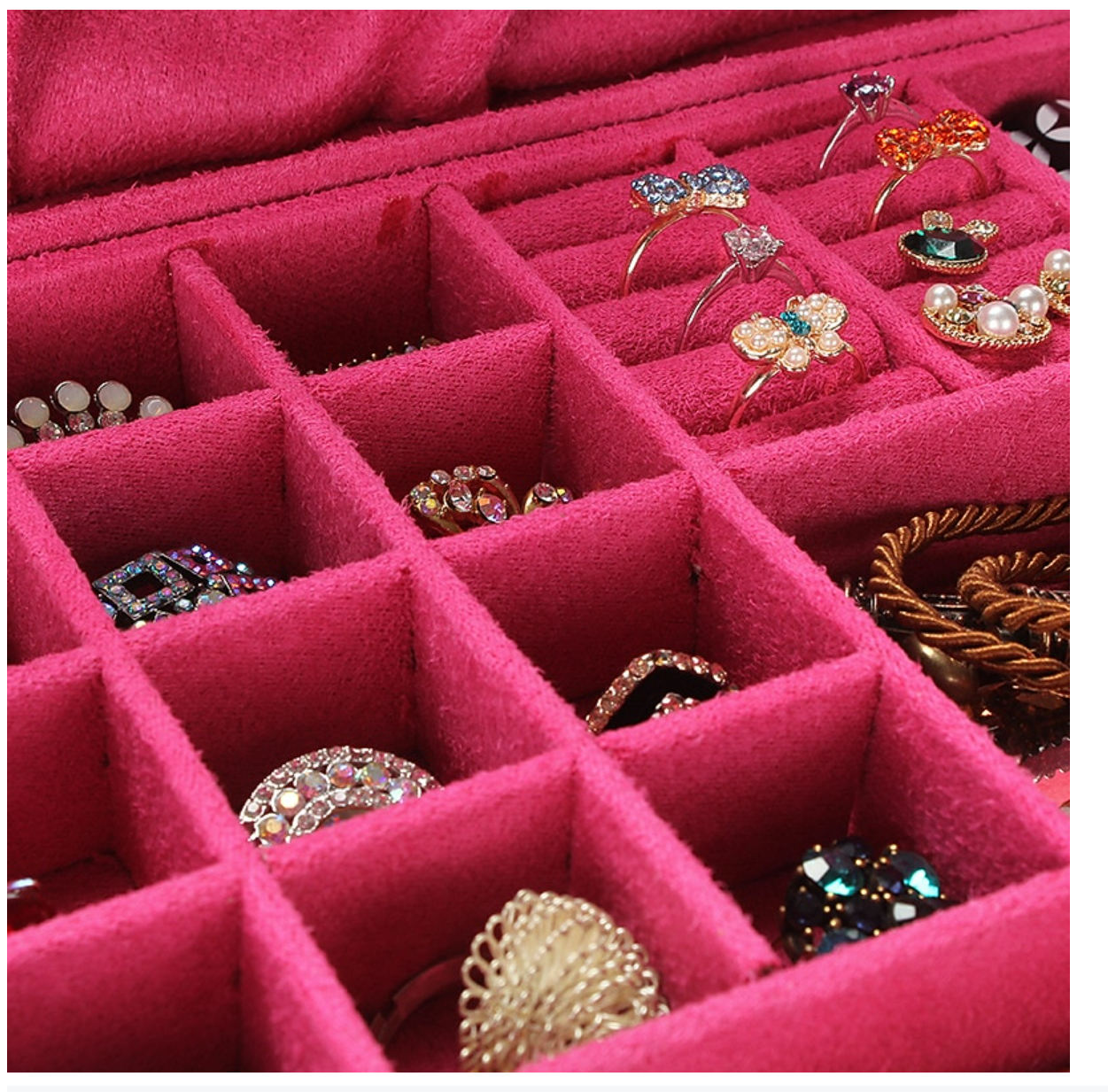 Open square velvet jewelry box with two storage layers.