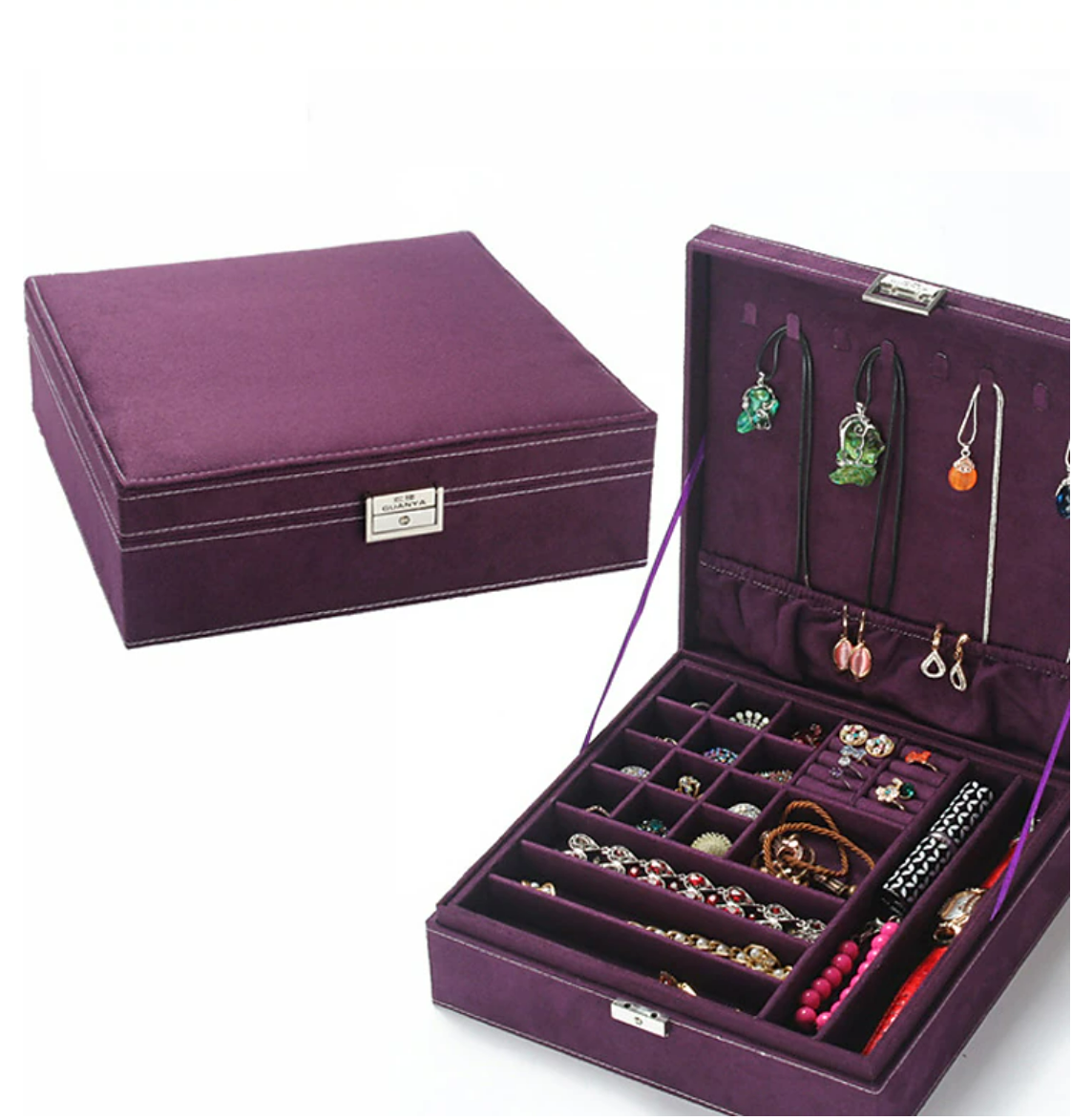 Open square velvet jewelry box showing organized compartments.